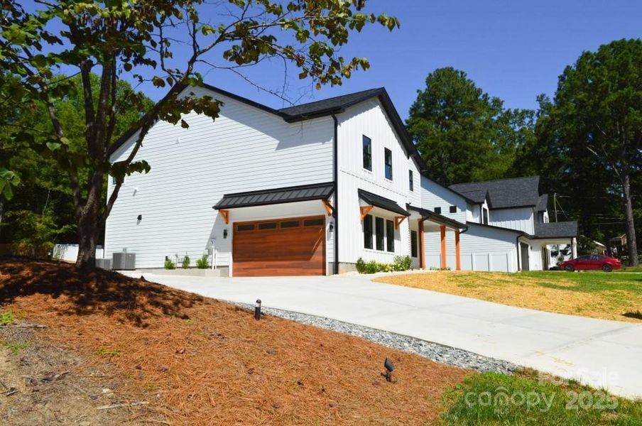 Front exterior of a new home in , Davidson, NC, highlighting curb appeal (Image 23).