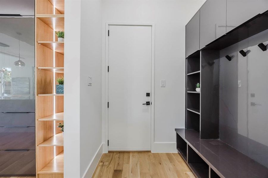 Mudroom with light wood-type flooring and baseboards Mudroom with light wood-type flooring and baseboards