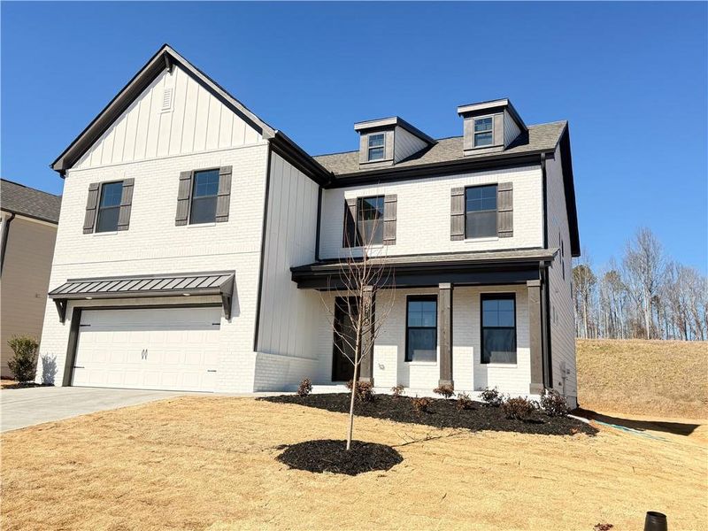 Front exterior of a new home in Ponderosa Farms Manor, Gainesville, GA, highlighting curb appeal (Image 21).
