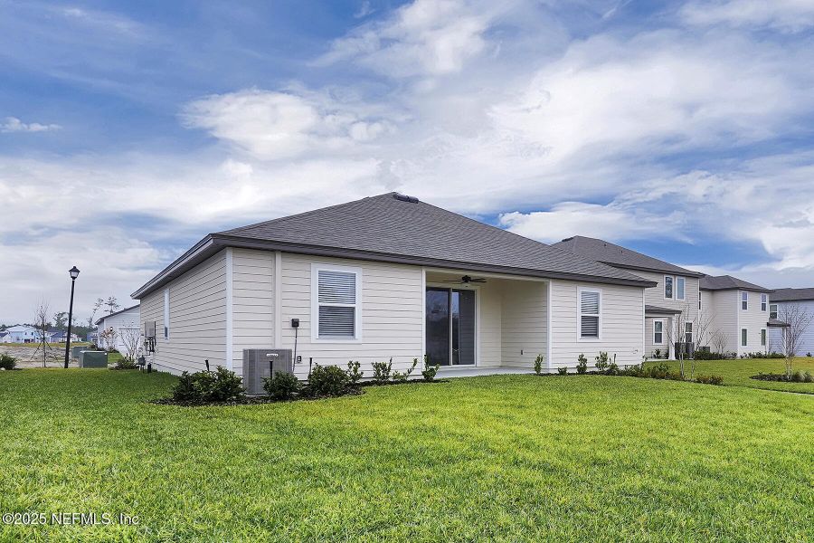 Front exterior of a new home in Jennings Farm, Middleburg, FL, highlighting curb appeal (Image 19).