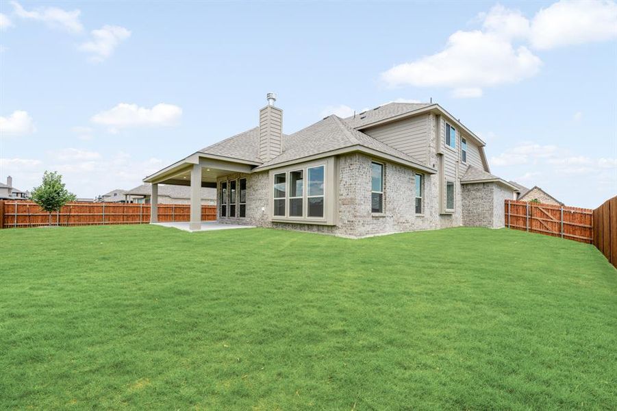 Front exterior of a new home in The Oasis at North Grove 75-80, Waxahachie, TX, highlighting curb appeal (Image 2). Front exterior of a new home in The Oasis at North Grove 75-80, Waxahachie, TX, highlighting curb appeal (Image 2).