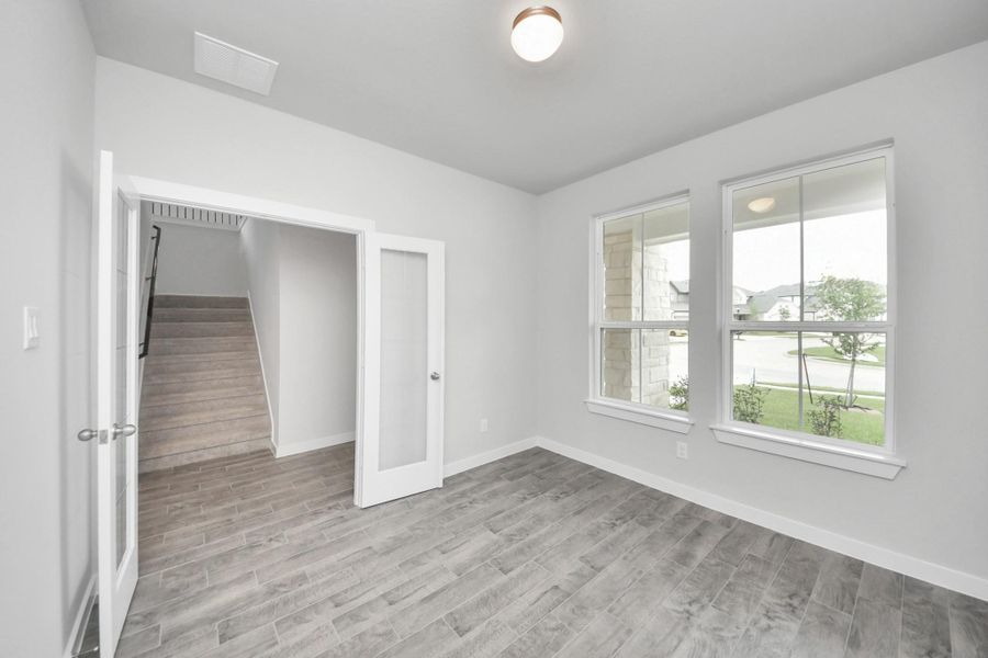 Quietly nestled in front of the home is the sophisticated home office. Quietly nestled in front of the home is the sophisticated home office.