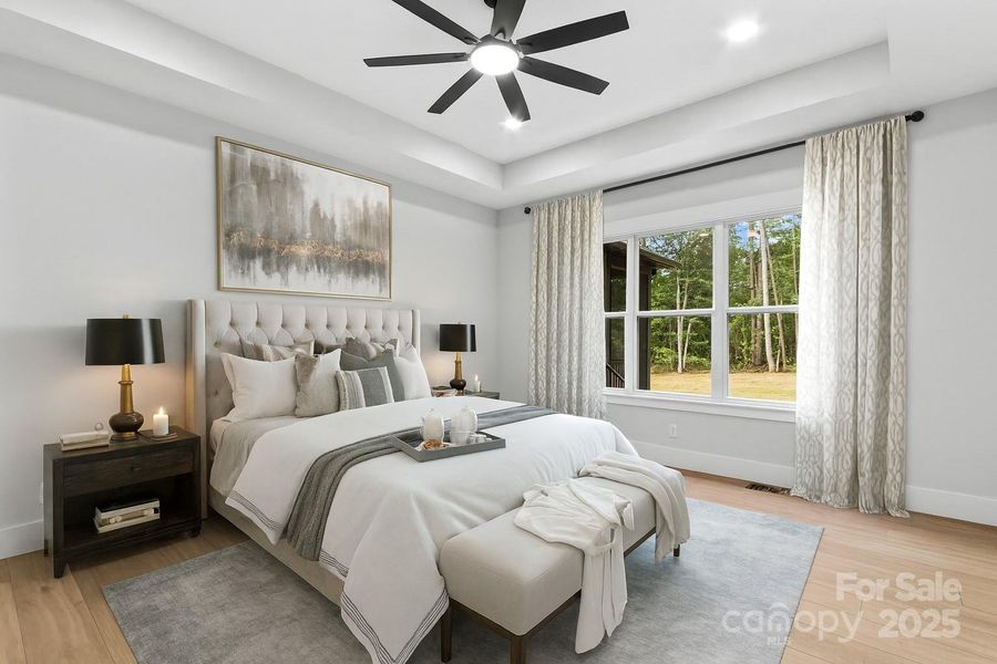 Main Bedroom is large with natural light & tray ceiling.