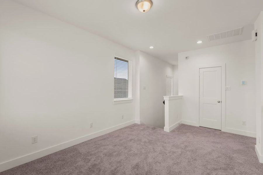 Representative unfurnished interior of a home built from the St Andrews by Chesmar Homes in Riceland Alley Loads, Mont Belvieu (Image 63).
