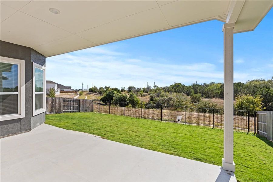 Exterior details and patio area of a home in Village at Three Oaks, Seguin (Image 23).
