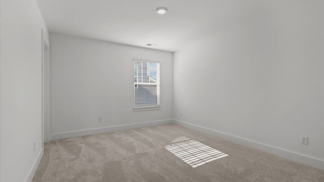 Representative furnished interior of a home built from the Freesia by DRB Homes in Harrier Point, Woodruff (Image 15).