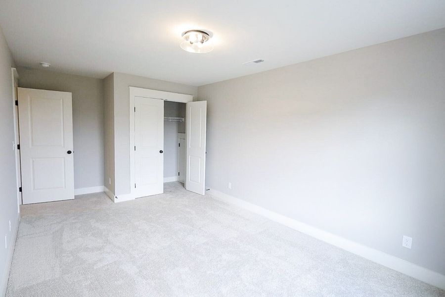 Spacious, unfurnished interior of a new home in Baker Road, Birchwood (Image 51).