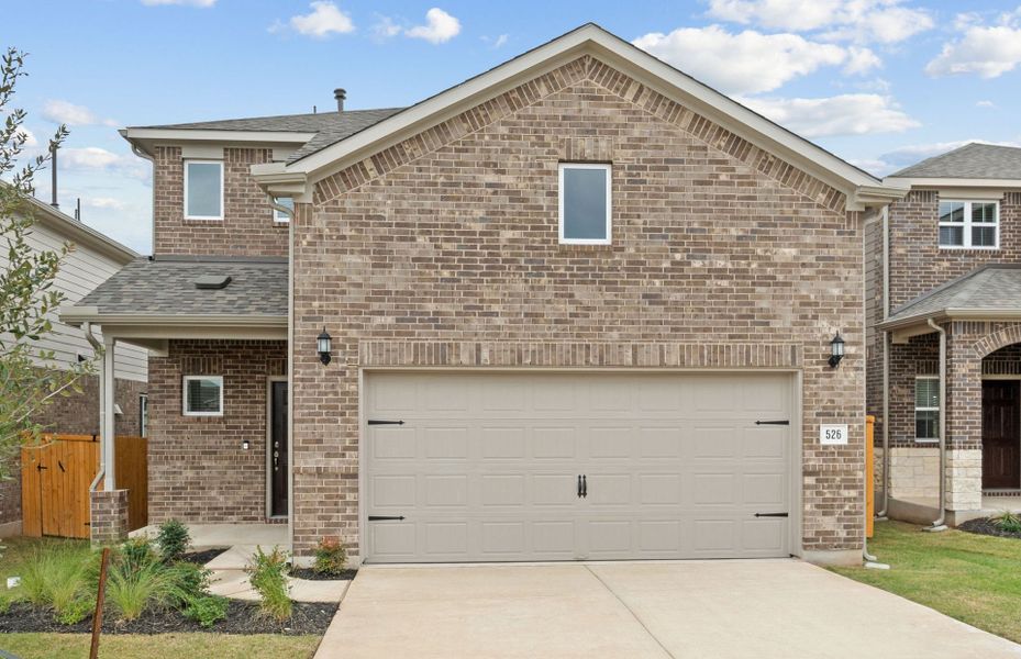 Front exterior of a new home in Crosswinds, Kyle, TX, highlighting curb appeal (Image 16).