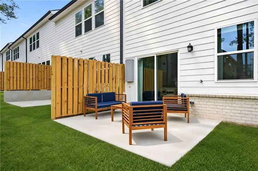 Exterior details and patio area of a home in Towns at Holly Springs, Holly Springs (Image 2). Exterior details and patio area of a home in Towns at Holly Springs, Holly Springs (Image 2).