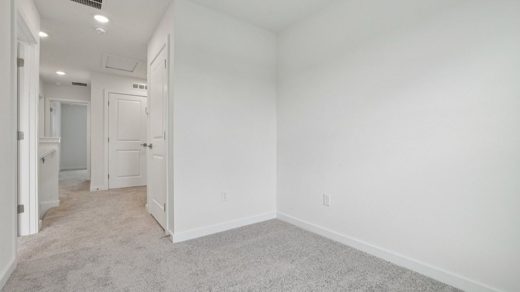 Upstairs Hallway of the Coronado - End at Cyrene at Harmony located in St Cloud FL by DRB Homes