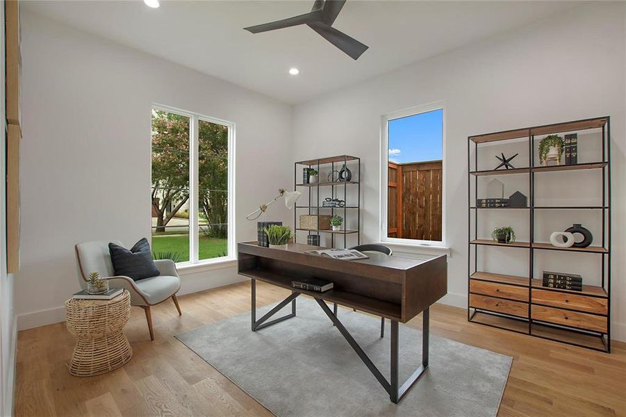 Office space with plenty of natural light, ceiling fan, recessed lighting, and light wood finished floors Office space with plenty of natural light, ceiling fan, recessed lighting, and light wood finished floors