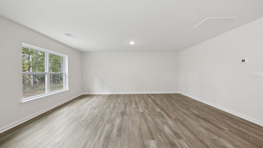 Spacious, unfurnished interior of a new home in Bentley Park, Greenwood (Image 22).