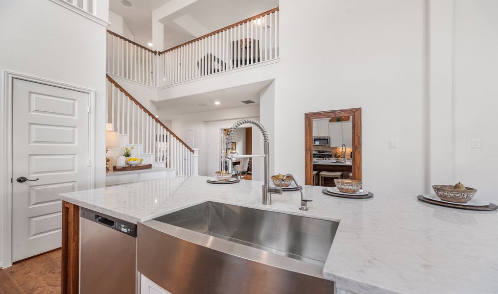 Kitchen with stainless steel apron-front sink