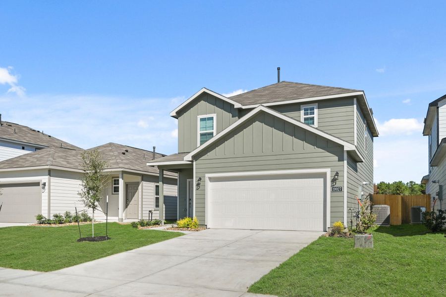 Front exterior of a new home in Northpark South, Porter, TX, highlighting curb appeal (Image 18). Front exterior of a new home in Northpark South, Porter, TX, highlighting curb appeal (Image 18).