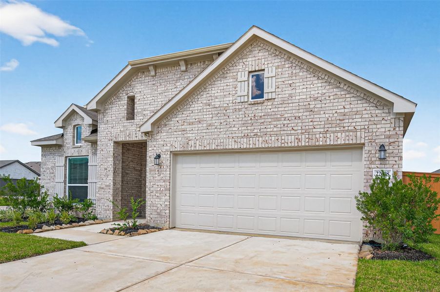 Front exterior of a new home in Cypress Green, Hockley, TX, highlighting curb appeal (Image 28). Front exterior of a new home in Cypress Green, Hockley, TX, highlighting curb appeal (Image 28).