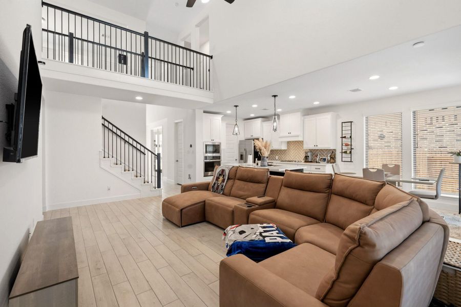 Expansive family room featuring high ceilings and abundant natural light