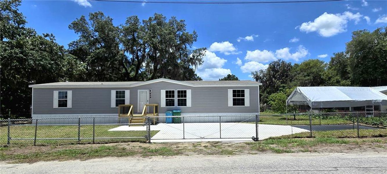 Front exterior of a new home in , Mascotte, FL, highlighting curb appeal (Image 1). Front exterior of a new home in , Mascotte, FL, highlighting curb appeal (Image 1).