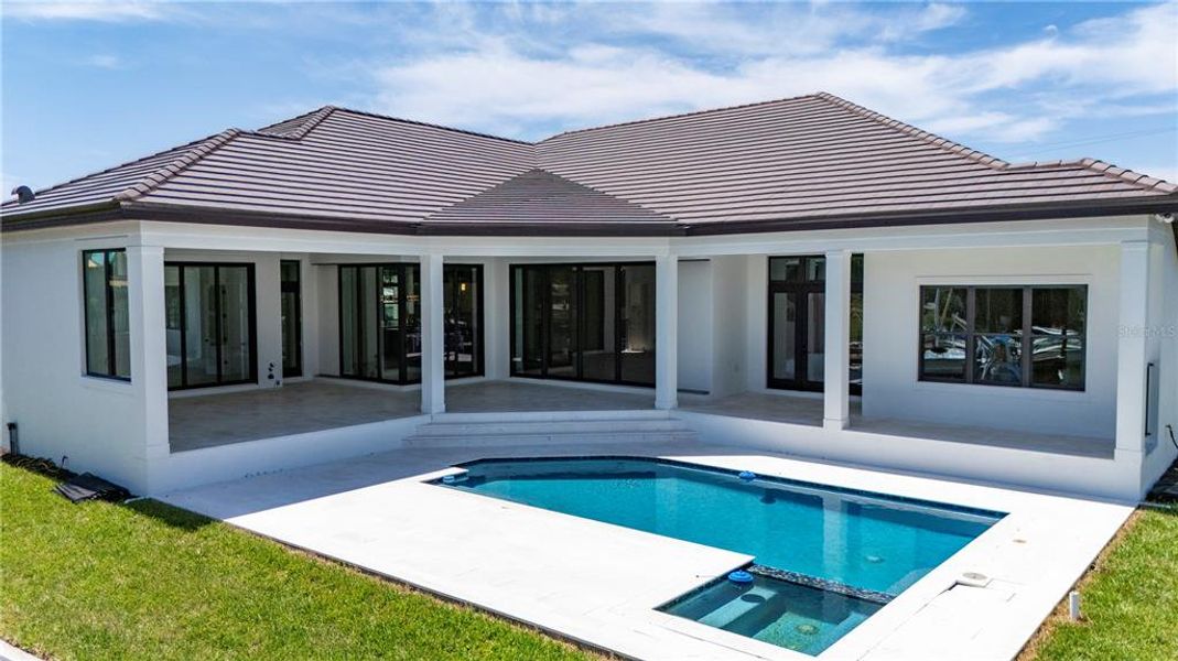 Front exterior of a new home in , Sarasota, FL, highlighting curb appeal (Image 12).