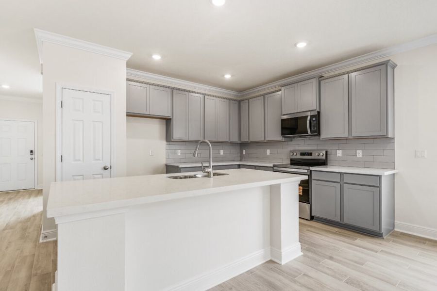 Furnished interior view inside a new home in Natureview, Freeport (Image 9).
