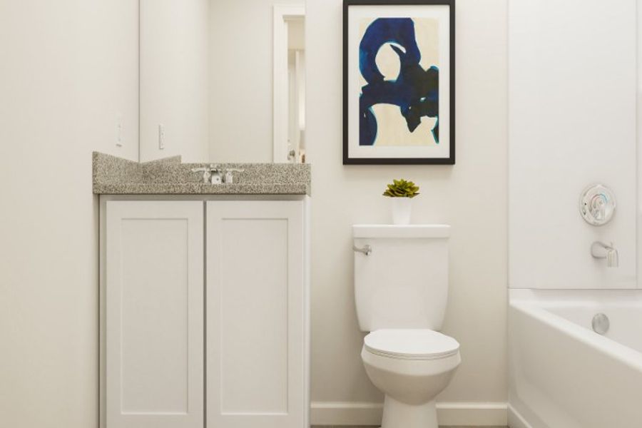 A bathroom with a toilet and sink.