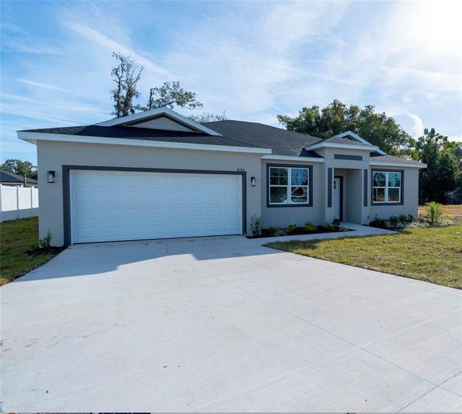 Front exterior of a new home in , Tavares, FL, highlighting curb appeal (Image 25).