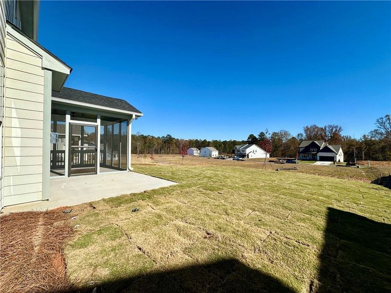 Exterior details and patio area of a home in Twin Lakes, Hoschton (Image 16).