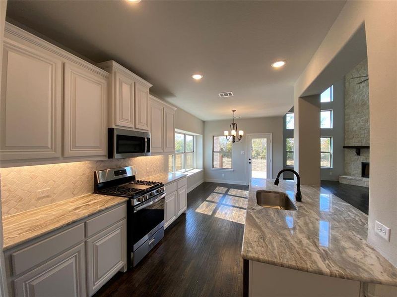 Kitchen has GAS stainless GE appliances