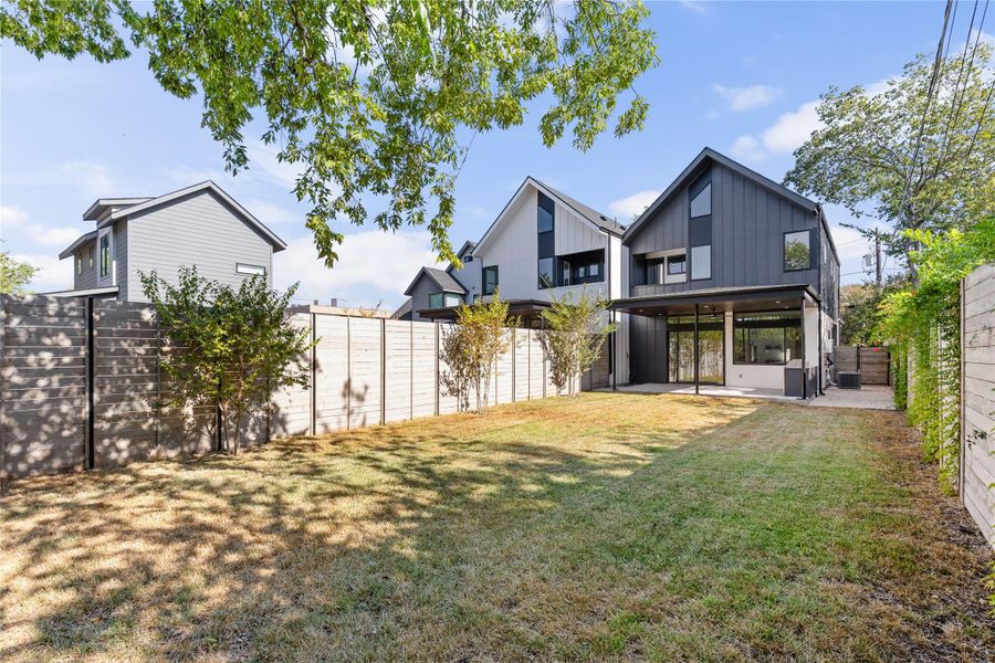 Fenced backyard with a patio area