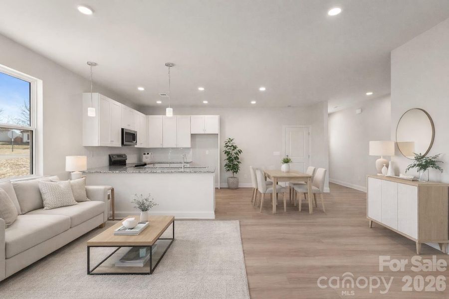 Virtually staged living room and dining/kitchen area