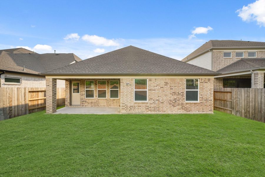 Front exterior of a new home in Sunterra North, Katy, TX, highlighting curb appeal (Image 2). Front exterior of a new home in Sunterra North, Katy, TX, highlighting curb appeal (Image 2).