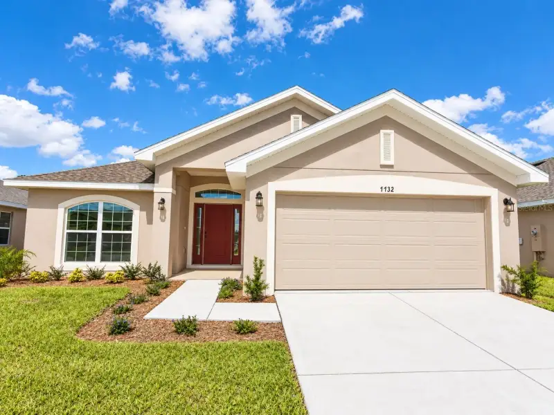 Front exterior of a new home in Harmony Central, St. Cloud, FL, highlighting curb appeal (Image 1). Front exterior of a new home in Harmony Central, St. Cloud, FL, highlighting curb appeal (Image 1).