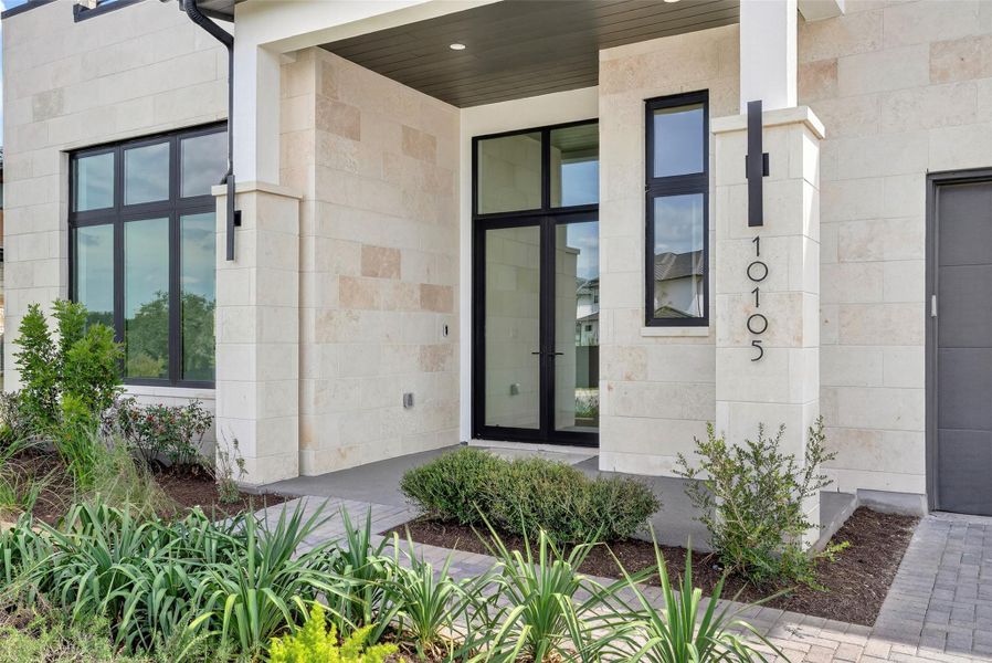 Exterior details and patio area of a home in Milky Way at River Place, Austin (Image 26).