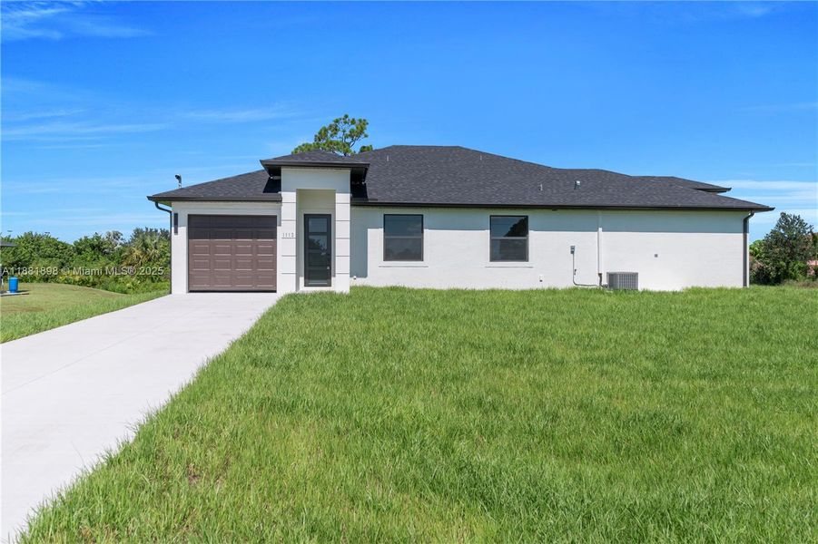 Front exterior of a new home in , Lehigh Acres, FL, highlighting curb appeal (Image 21).