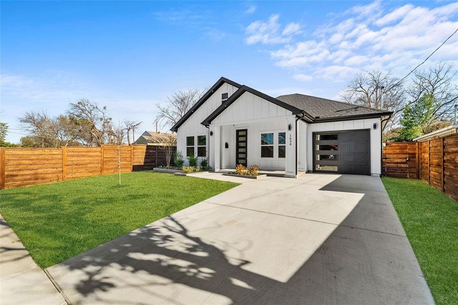 Front exterior of a new home in , Dallas, TX, highlighting curb appeal (Image 22).