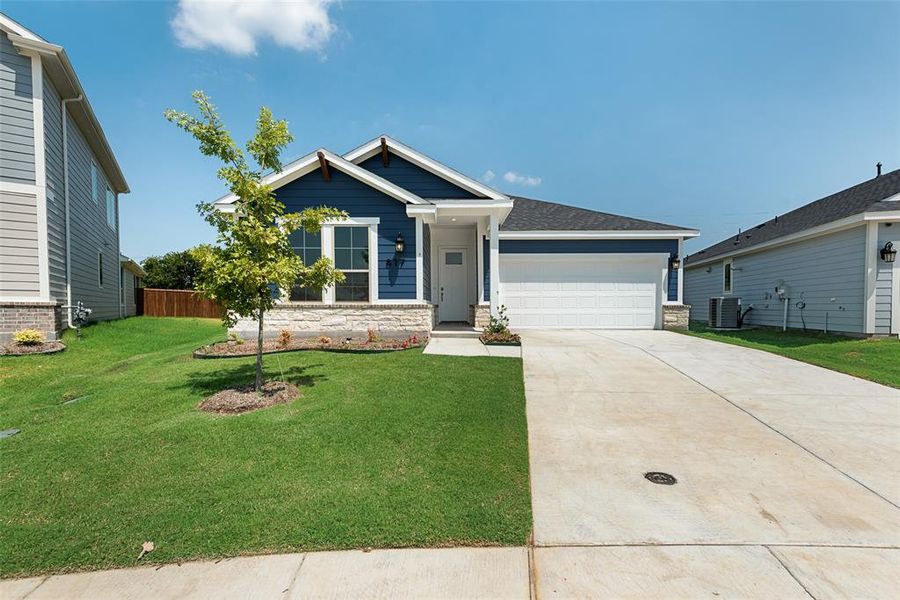 Front exterior of a new home in Creekside of Crowley, Crowley, TX, highlighting curb appeal (Image 2). Front exterior of a new home in Creekside of Crowley, Crowley, TX, highlighting curb appeal (Image 2).