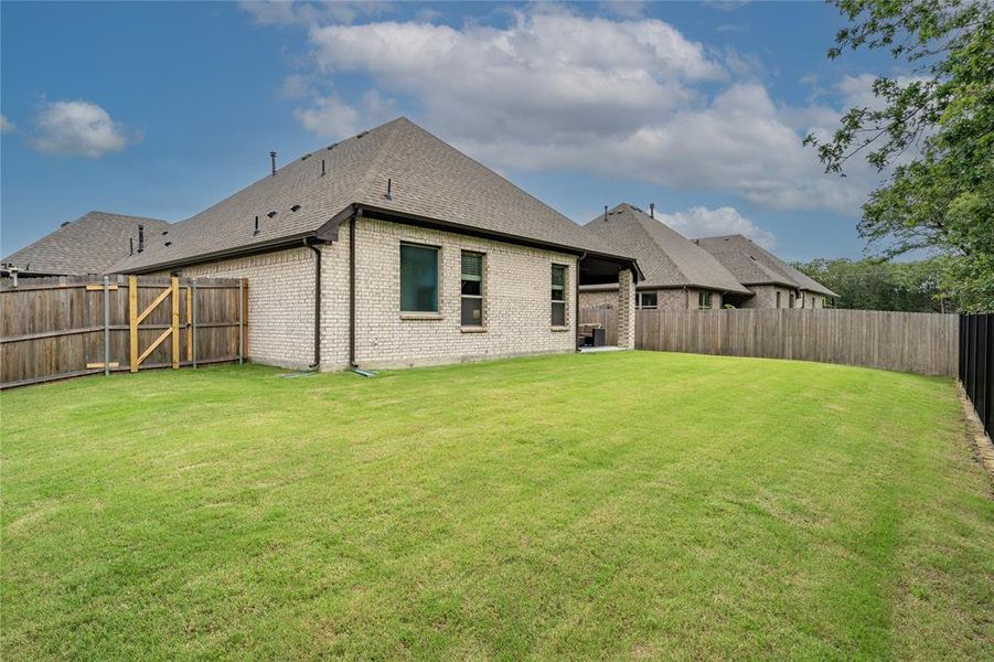 Gate side and rear of home.