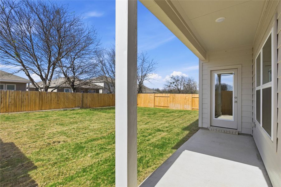 Exterior details and patio area of a home in Infinity Square, Kyle (Image 2). Exterior details and patio area of a home in Infinity Square, Kyle (Image 2).