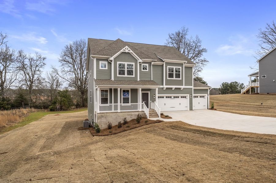 Front exterior of a new home in Ridgecrest at Midway, Anderson, SC, highlighting curb appeal (Image 23).