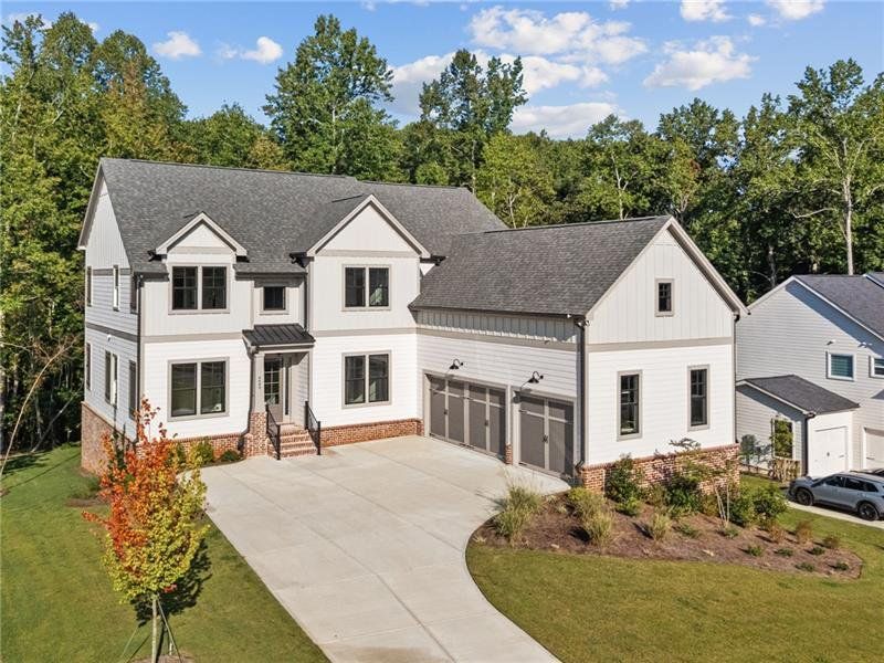 Front exterior of a new home in Arden on Lanier, Cumming, GA, highlighting curb appeal (Image 2).