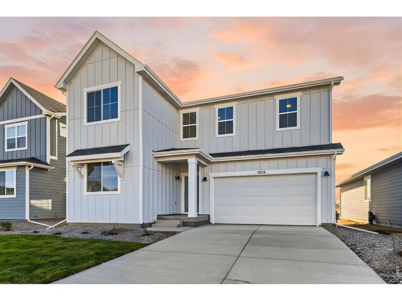 Front exterior of a new home in Farmstead, Berthoud, CO, highlighting curb appeal (Image 24). Front exterior of a new home in Farmstead, Berthoud, CO, highlighting curb appeal (Image 24).