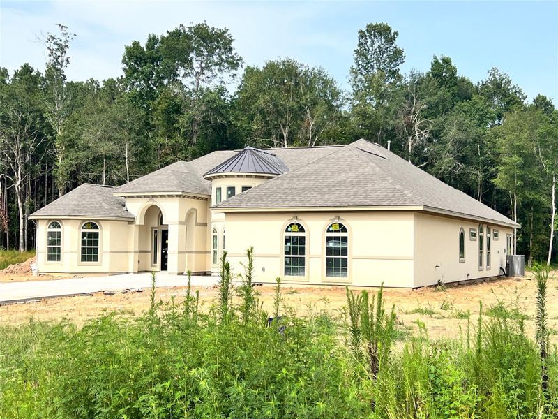 Front exterior of a new home in , Dayton, TX, highlighting curb appeal (Image 2).