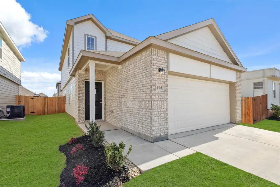Front exterior of a new home in Hanna Ranch, Everman, TX, highlighting curb appeal (Image 1).
