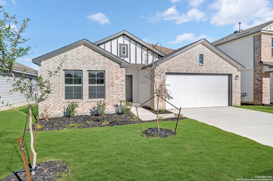Front exterior of a new home in Winding Brook, San Antonio, TX, highlighting curb appeal (Image 19).