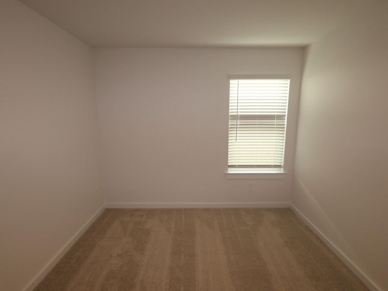 Spacious, unfurnished interior of a new home in Pinewood at Grand Texas, New Caney (Image 22).