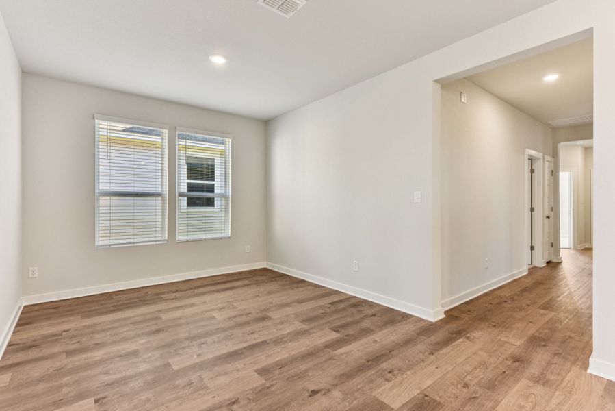 A room with a wood floor and a wood floor.