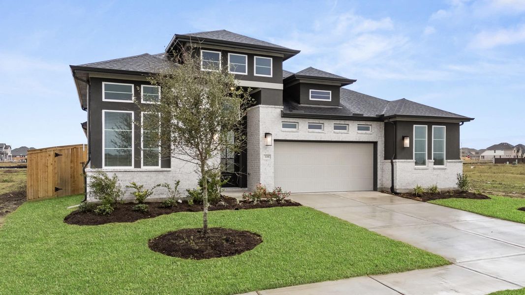 Front exterior of a new home in Brookewater, Rosenberg, TX, highlighting curb appeal (Image 21).