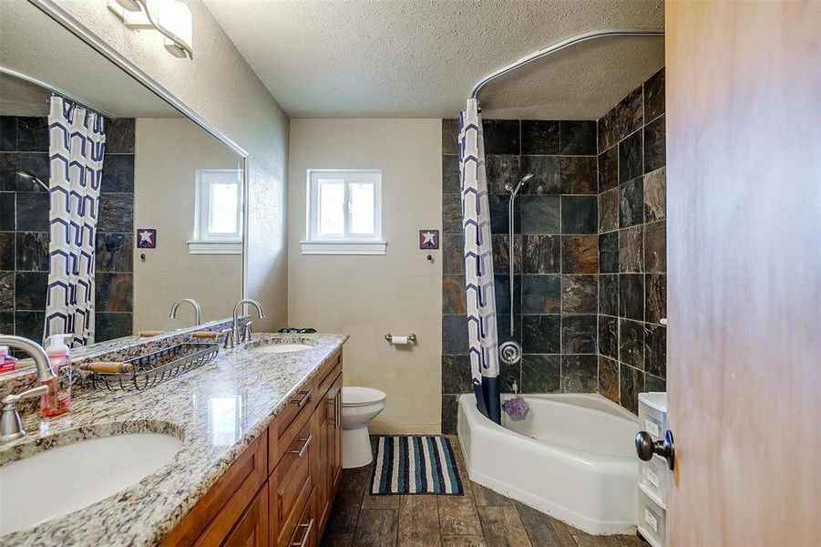 2nd full bath with dual sinks & granite countertops.