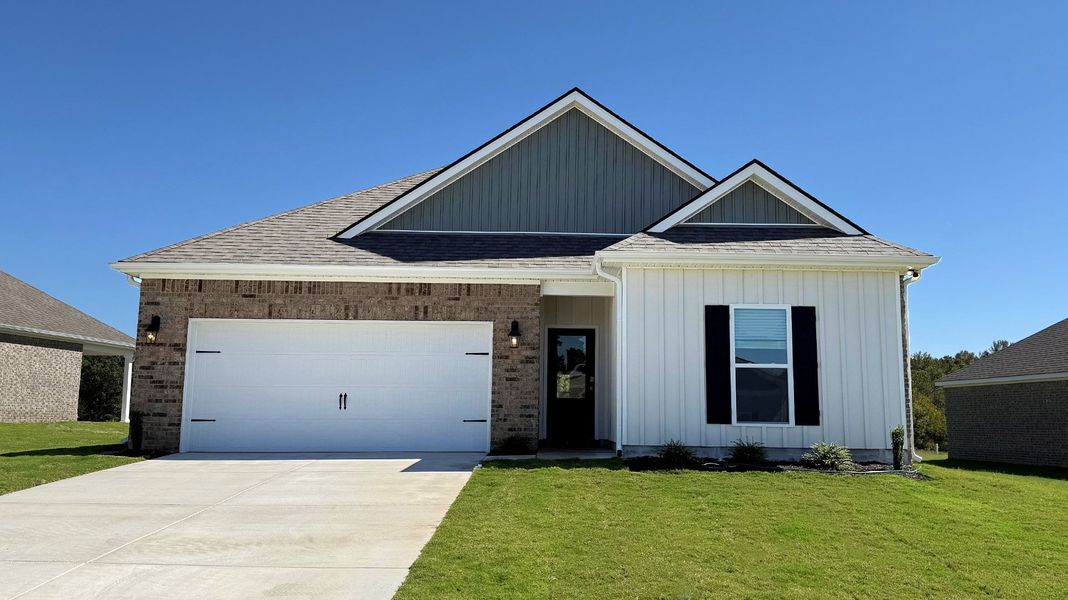 Front exterior of a new home in Village Park, Oakland, TN, highlighting curb appeal (Image 1).