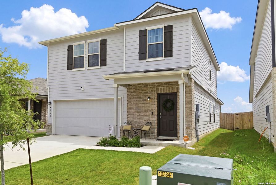 Front exterior of a new home in Park Place, New Braunfels, TX, highlighting curb appeal (Image 1). Front exterior of a new home in Park Place, New Braunfels, TX, highlighting curb appeal (Image 1).
