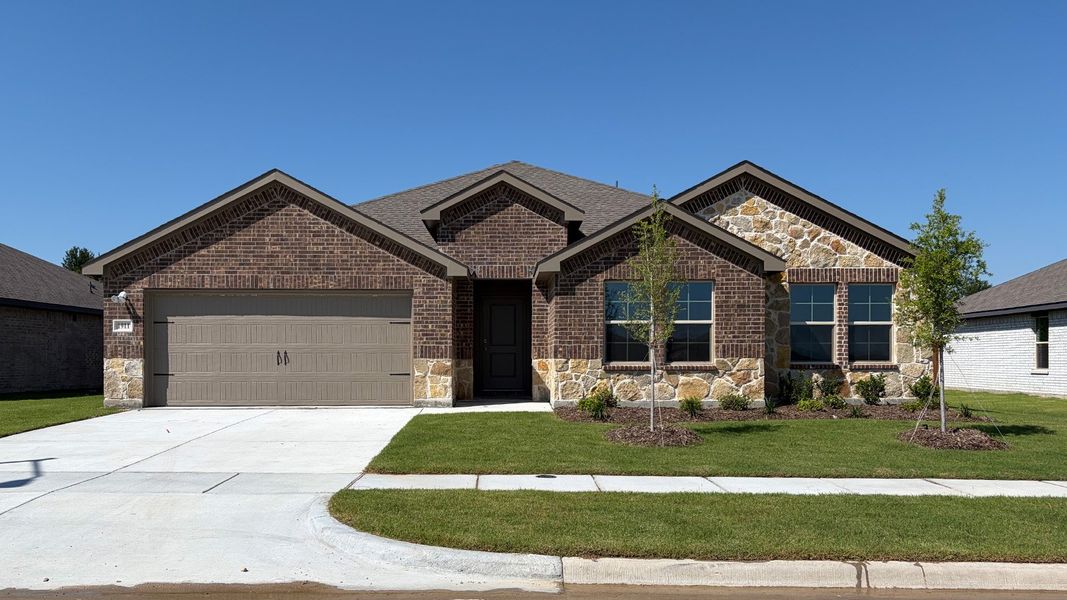 Front exterior of a new home in Northspur, Terrell, TX, highlighting curb appeal (Image 1). Front exterior of a new home in Northspur, Terrell, TX, highlighting curb appeal (Image 1).